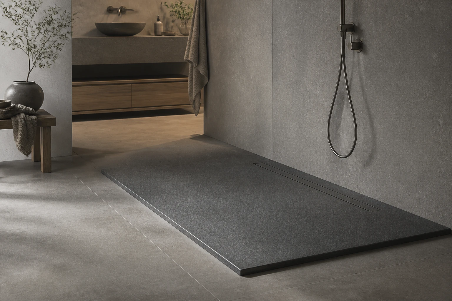Low-profile stone resin shower tray in a grey wet room